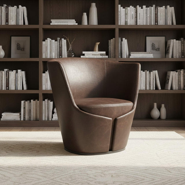 A Dapper Armchair upholstered in brown leather takes pride of place in a modern home office.