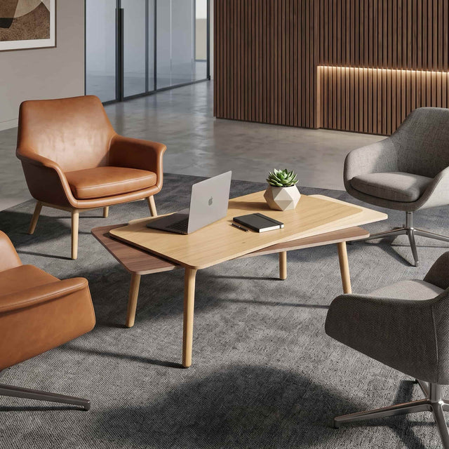 A wooden Stacked Coffee table takes centre stage among 4 swivel chairs in a communal area of a modern workplace.