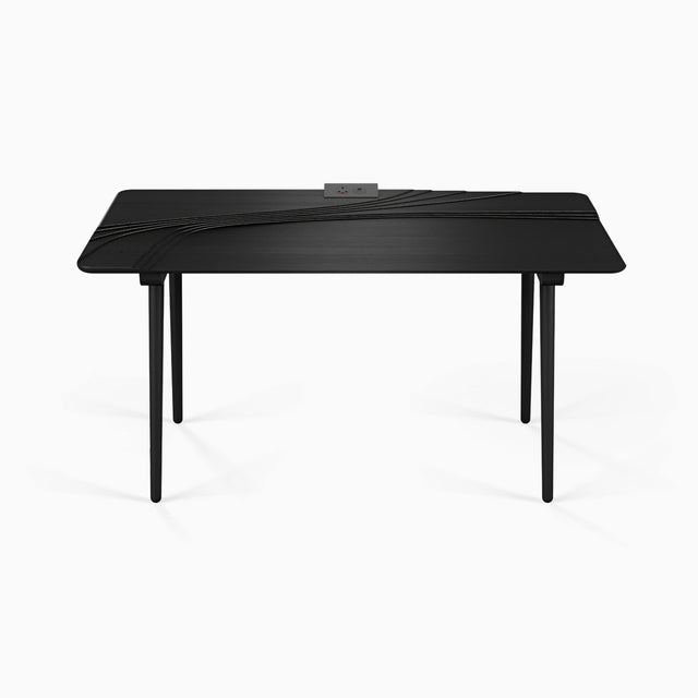 A Terrace Desk in black-stained Oak, with an optional dual-socket desktop power supply.