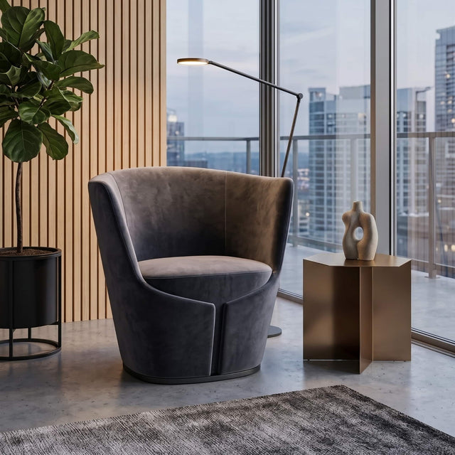 The Dapper Armchair in a black velvet looking suave in a quiet space of a modern commercial workplace.