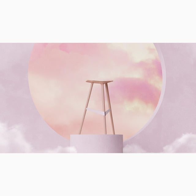 A single Delta bar stool stands tall on a podium, showcasing its streamlined form-factor and dynamic stance.