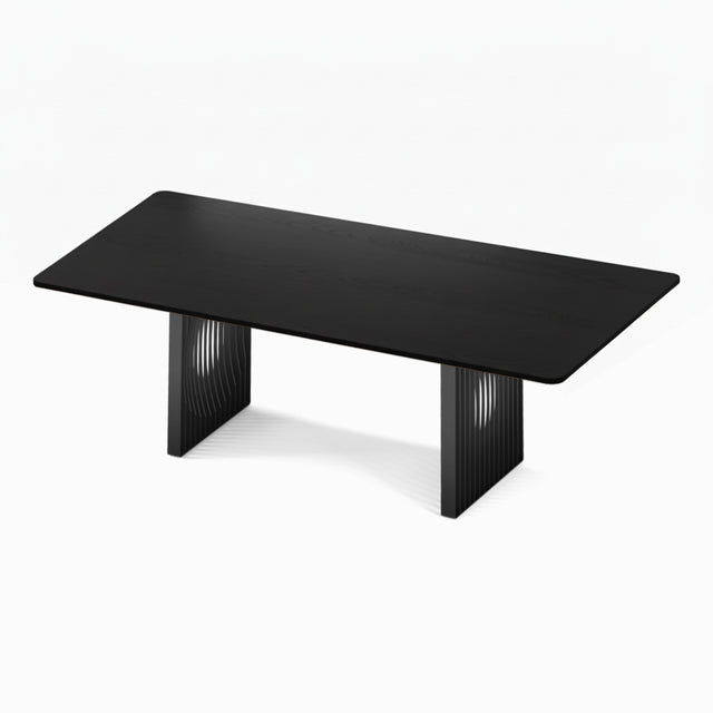 The Phantom Dining Table with an ebonised black solid Ash tabletop and black powder coated steel bases.