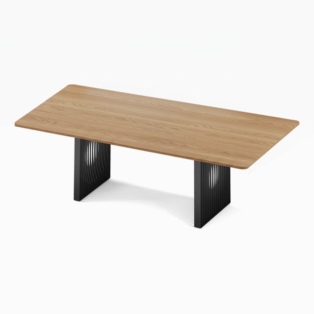 The Phantom Dining Table with a solid Oak tabletop and black powder coated steel bases.