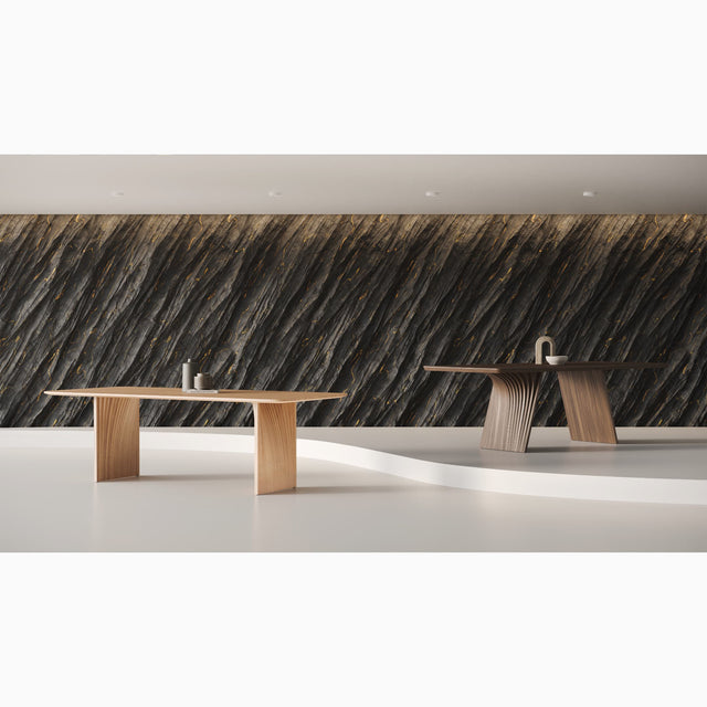 The Sheer dining table in Oak, and the Veer dining table in Walnut. Both designs are inspired by geological rock formations.