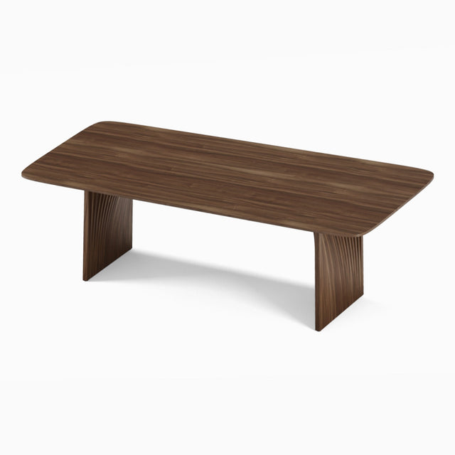 Sheer dining table in solid American black walnut with sculptural legs.