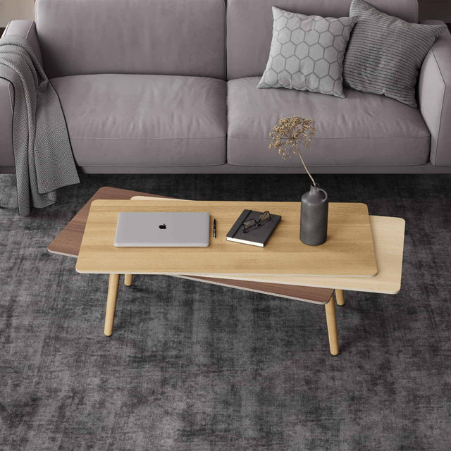 A Stacked coffee table in wood. This version has an Oak tabletop, Maple middle and Walnut bottom, with solid Oak legs.