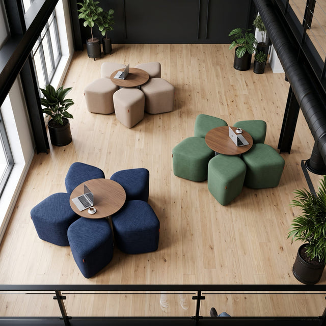 Plan view of a common area in a commercial venue, where three Blossom seating systems with table are neatly arranged and ready for use.