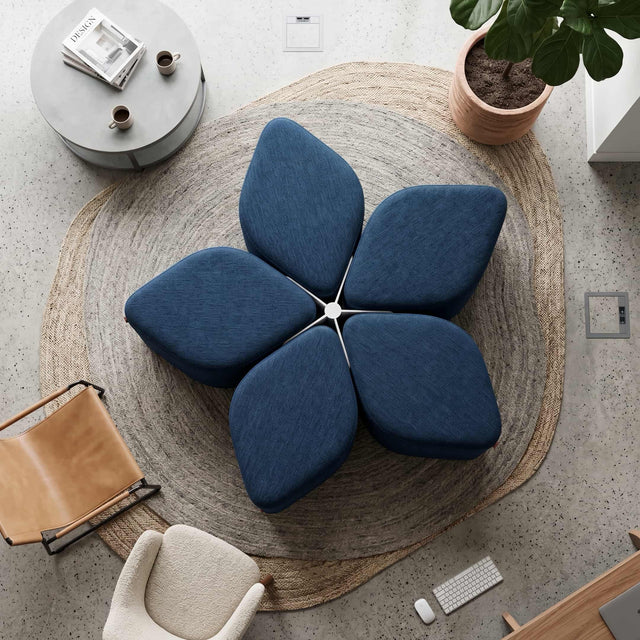Plan view of a Blossom Seating System in blue fabric, with all 5 poufs stowed neatly in within the docking base. 