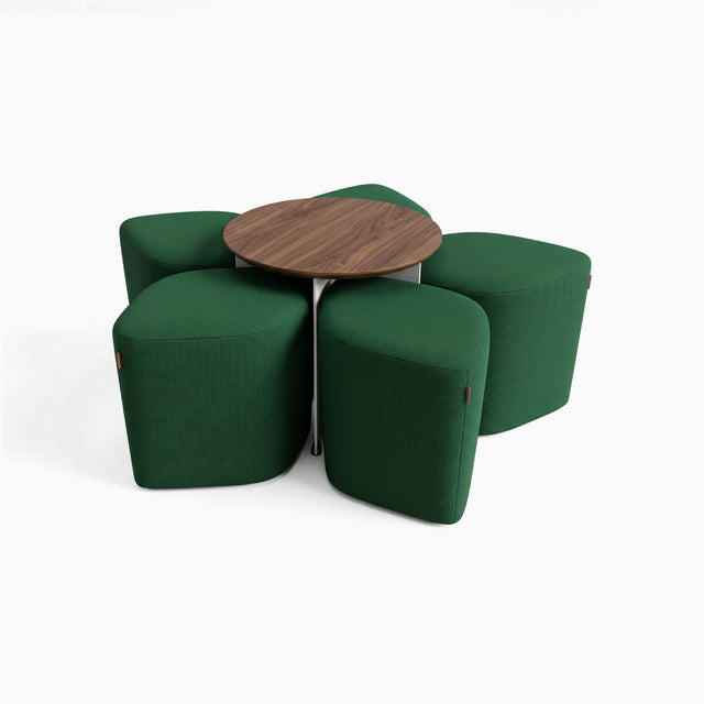 Five diamond-shaped poufs in racing green fabric arranged around a central table, creating a flower-like formation.