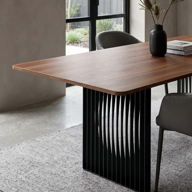 Close up view of the slatted construction of the Phantom dining table in a modern living room.