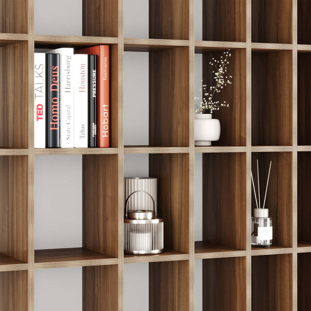 Close up of the Doppler bookcase in Walnut, showing the varying distances between each upright.