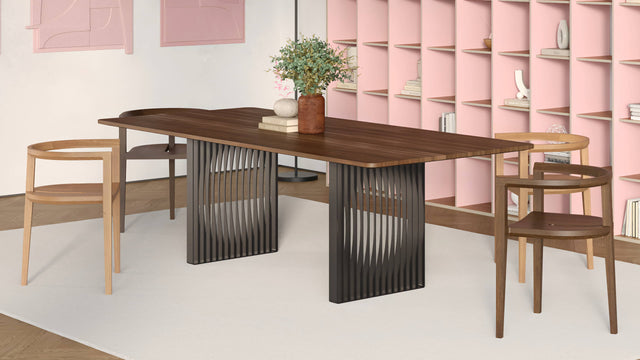 The 2 bases of the Phantom dining table are constructed of shaped slats that create ghostly, circular negative spaces.