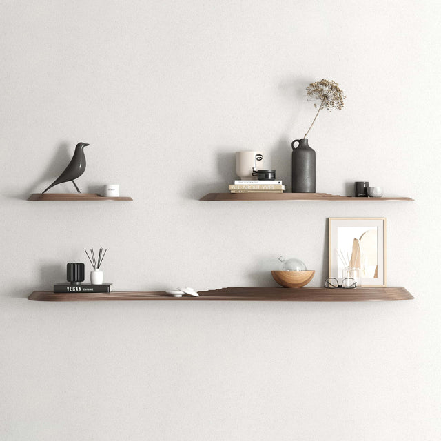 The Terrace wall shelves in Walnut. Each has platforms are different heights, allowing a novel way to display decorations.