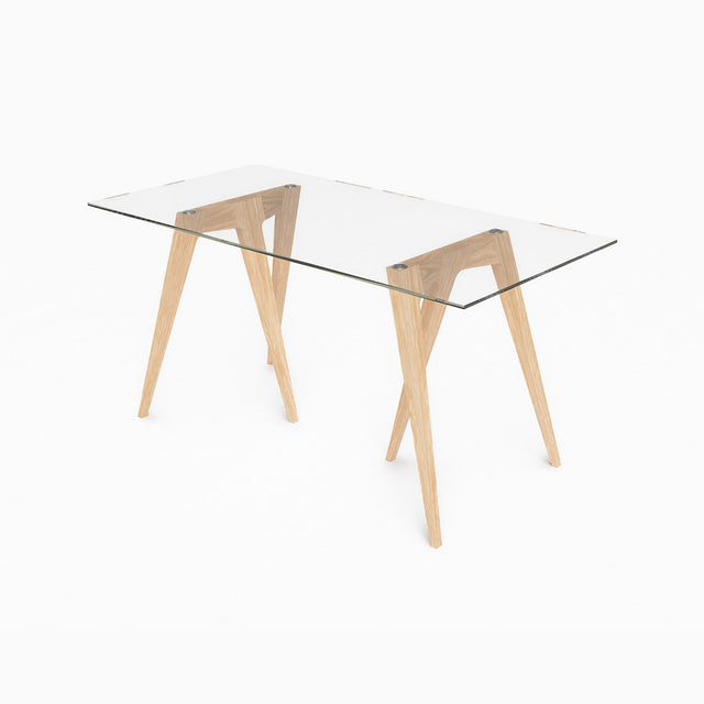 A pair of solid Oak Flex Trestle Desk Legs are paired with a glass tabletop to form a smart, simple desk.