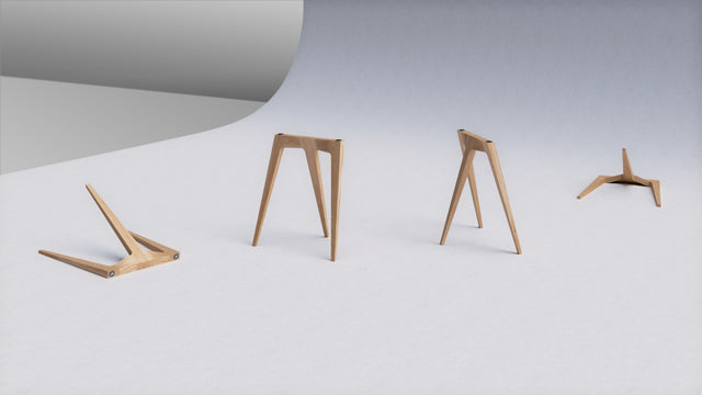 Four Flex Desk Legs scattered on a studio backdrop to show its form and construction from different angles.