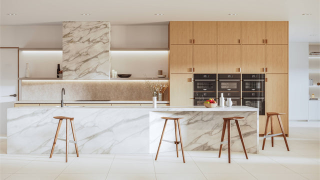 Four Walnut Delta counter stools take pride of place in a contemporary kitchen. The stool’s sleek design complements the clean, minimalist lines of the kitchen’s aesthetics.