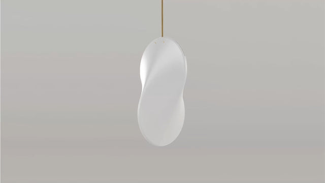 A single Oh Lloyd! pendant light with brass fixings and gold fabric-covered cable.