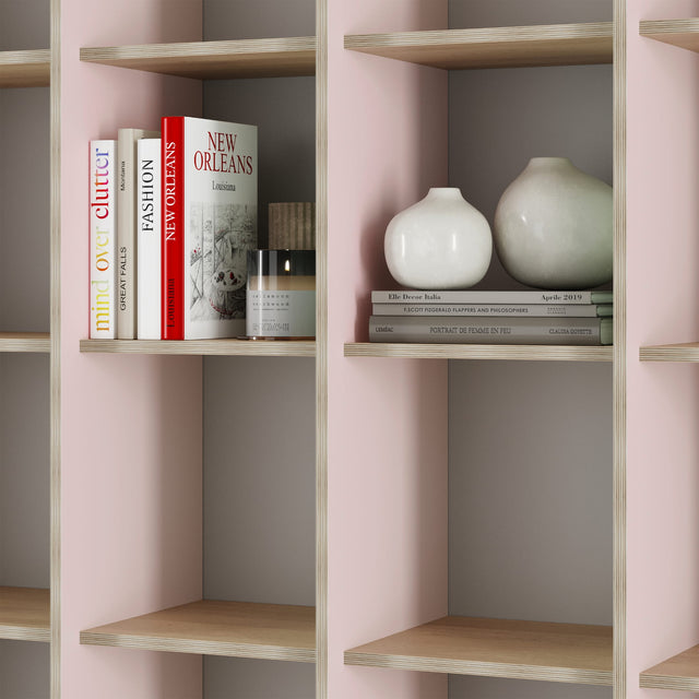 The green and pink P.O.V. bookcase appears pink from the right side because of the pink laminate applied to the right of each upright.