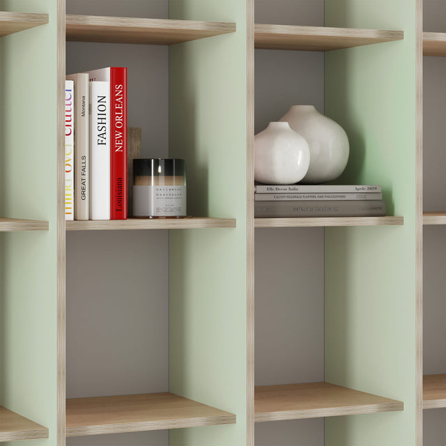The green and pink P.O.V. bookcase appears green from the left side because of the green laminate applied to the left of each upright.