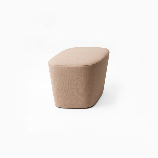 Petal is a modern, diamond-shaped ottoman upholstered in a warm taupe-beige fabric, shown on a clean white background.