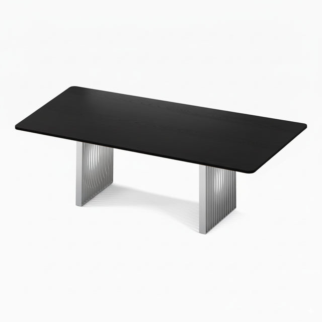 The Phantom Dining Table with an ebonised black solid Ash tabletop and metallic silver powder coated steel bases.