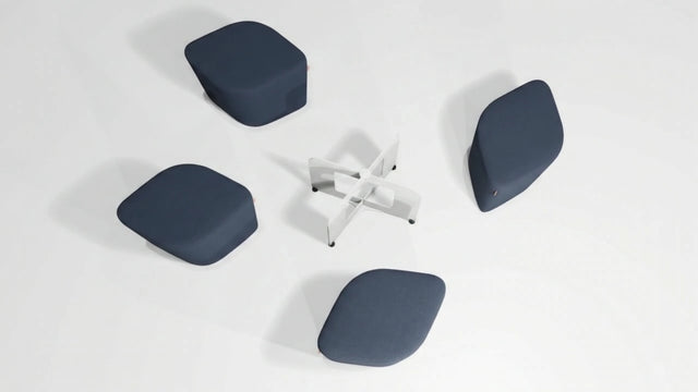 In this Rhombic Seating System, four blue poufs are pulled away from the docking station and left in an untidy manner.
