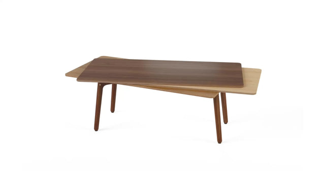 A Stacked coffee table in wood. This version comprises a Walnut tabletop, Maple middle and Oak bottom layer, with Walnut legs.