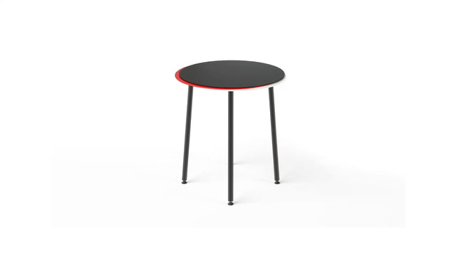 The Stacked side table in black/red/white. The tabletop is constructed of 3 layers, each slightly displaced and each in a different colour to create a unique aesthetic.