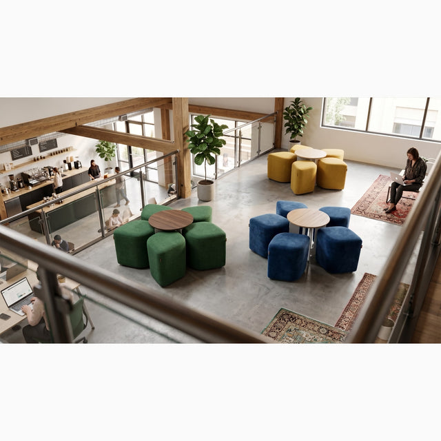 Three Blossom seating systems bring colour to a mezzanine lounge area: one with yellow poufs and an Oak table, another with blue poufs and an Oak table, and a third with green poufs and a Walnut table.