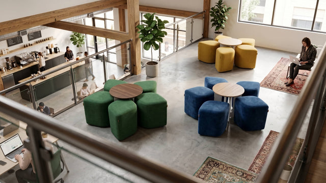Three Blossom seating systems bring colour to a mezzanine lounge area: one with yellow poufs and an Oak table, another with blue poufs and an Oak table, and a third with green poufs and a Walnut table.