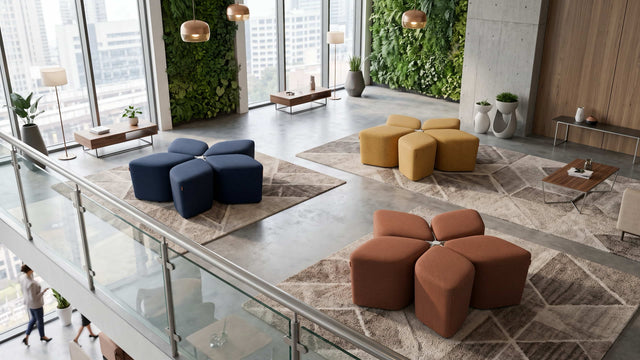 Three Blossom Seating Systems each in a different coloured fabric, neatly arranged in an open plan communal space.