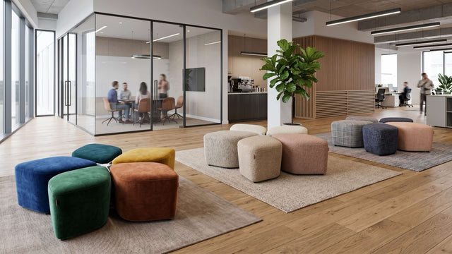 Three Blossom Seating Systems upholstered in a range of fabrics, and neatly arranged, in a shared space of a modern office.