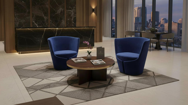 Two Dapper Armchairs in blue in a waiting area in a 5 star hotel.