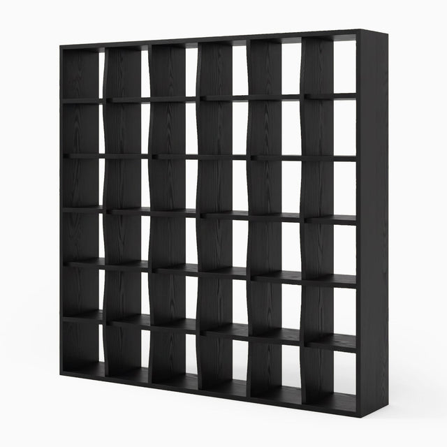 The Weave Bookcase in black stained Ash. The shelves and vertical supports appear to intertwine with one another, giving the impression of a woven structure.