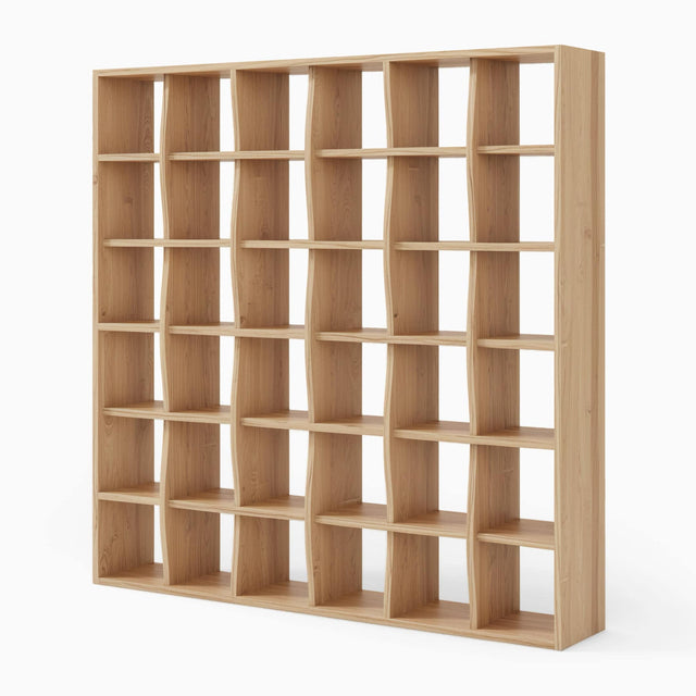 The Weave Bookcase in Oak. The shelves and vertical supports appear to weave together in a knitted pattern.